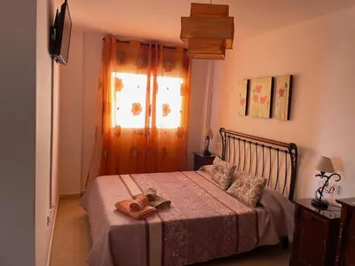 Cama o camas de una habitación en Ático Cabo de Gata con Terraza y vistas al mar, jacuzzi de exterior en temporada