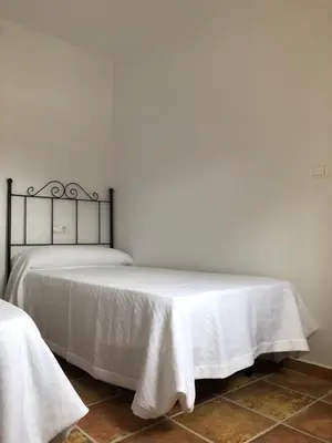Cama o camas de una habitación en El Cortijillo