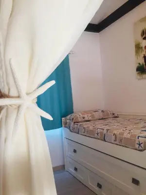 Cama o camas de una habitación en PRECIOSA CASITA JUNTO AL MAR