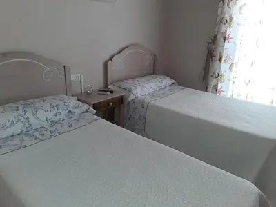 Cama o camas de una habitación en pension hernandez