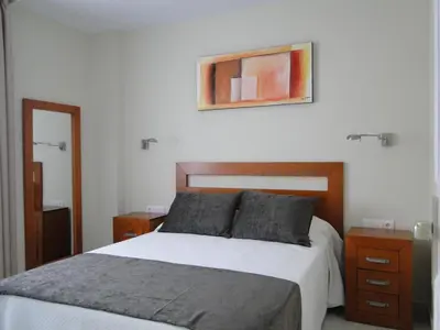 Cama o camas de una habitación en APARTAMENTOS MAR Y GOLF