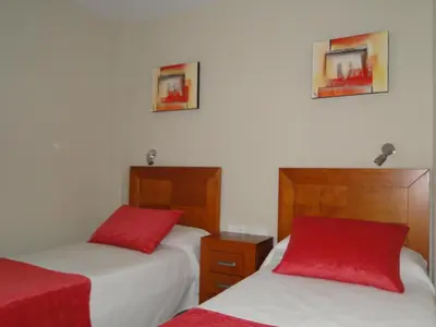 Cama o camas de una habitación en APARTAMENTOS MAR Y GOLF