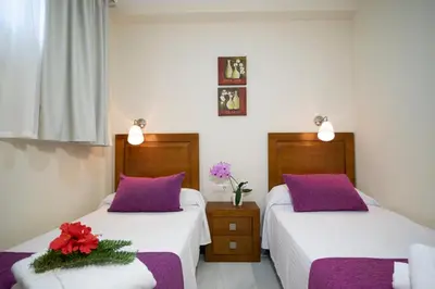 Cama o camas de una habitación en APARTAMENTOS MAR Y GOLF