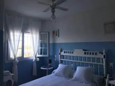 Cama o camas de una habitación en Villa Rocio, 1ª línea playa y Parque Natural - planta baja