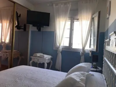 Cama o camas de una habitación en Villa Rocio, 1ª línea playa y Parque Natural - planta baja
