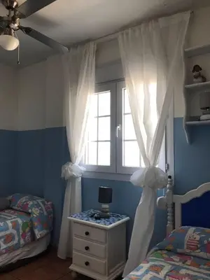 Cama o camas de una habitación en Villa Rocio, 1ª línea playa y Parque Natural - planta baja