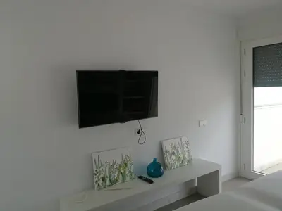 Una televisión o centro de entretenimiento en Casa David