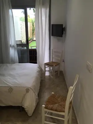 Cama o camas de una habitación en oasis del toyo golf&beach private garden wifi