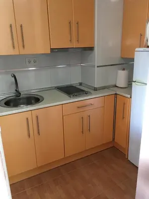 Una cocina o zona de cocina en APARTAMENTO CERCA DE LA PLAYA