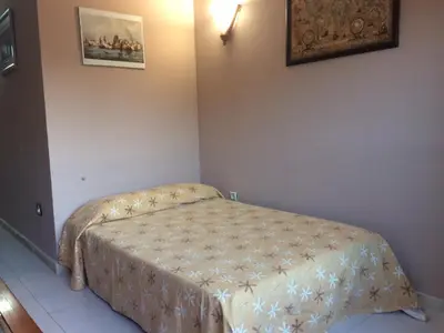 Cama o camas de una habitación en APARTAMENTO CERCA DE LA PLAYA