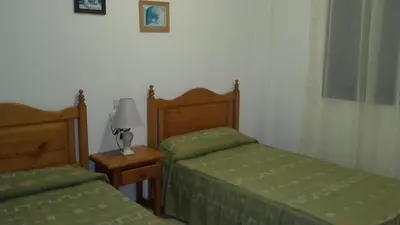Cama o camas de una habitación en Apartamento 3 Hab. en el Parador