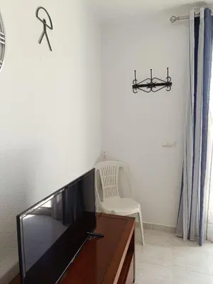 Una televisión o centro de entretenimiento en Vera Natura Apartamento Isabel