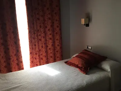 Cama o camas de una habitación en Apartamentos Jardines de Lorca