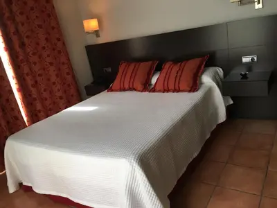 Cama o camas de una habitación en Apartamentos Jardines de Lorca