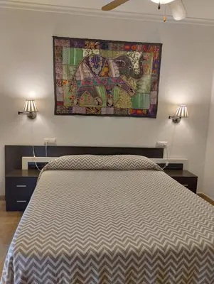 Cama o camas de una habitación en Bahía de Vera Apartamento Hibiscus