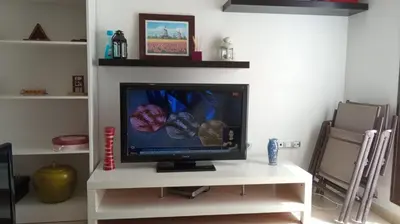 Una televisión o centro de entretenimiento en Urb. Los Collados .Águilas Apartamento