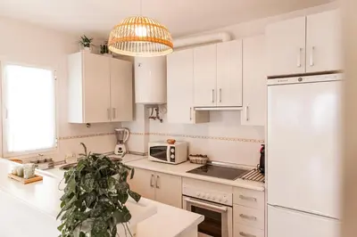 Una cocina o zona de cocina en Precioso Ático con vistas al mar