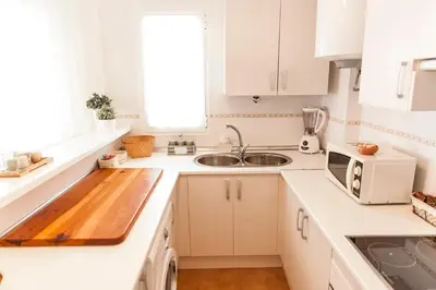 Una cocina o zona de cocina en Precioso Ático con vistas al mar