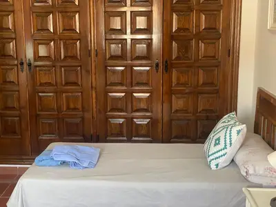 Cama o camas de una habitación en Palacete Magistral Domínguez habitaciones