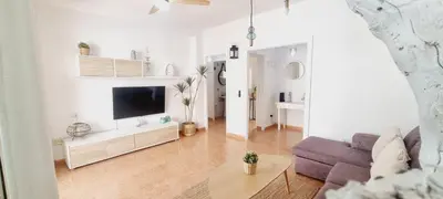 Una televisión o centro de entretenimiento en BEACH HOUSE AGUILAS - Excelente Ubicacion!! Centro con Vistas Playa Delicias con Aire