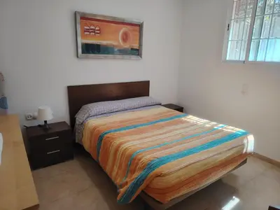 Cama o camas de una habitación en APARTAMENTO JAZMINERO