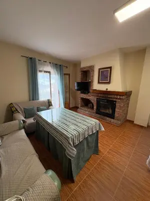 Una televisión o centro de entretenimiento en Casa Rosa