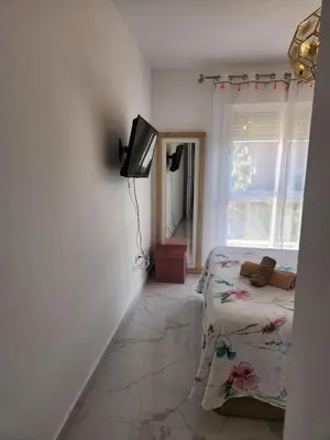 Una televisión o centro de entretenimiento en ÁTICO DUPLEX ESPECTACULAR MARMOLADO con PISCINA PRIVADA!