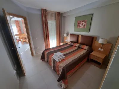 Cama o camas de una habitación en Avenida de Juan Sebastián Elcano Apartamento 1A02