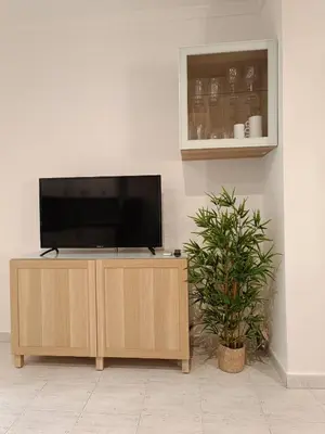 Una televisión o centro de entretenimiento en Vera Natura Apartamento Maria
