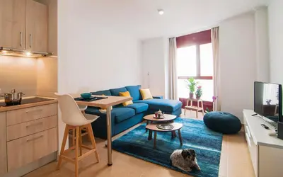 Una televisión o centro de entretenimiento en Apartamentos Vida Almería