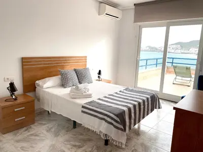 Cama o camas de una habitación en Apartamentos El Puerto