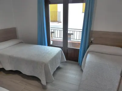 Cama o camas de una habitación en Hostal Casa Fermina- A 2 horas de las pistas de esquí