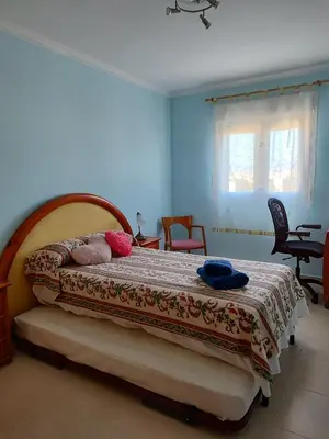 Cama o camas de una habitación en Apartamentos San Miguel 2