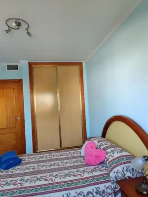 Cama o camas de una habitación en Apartamentos San Miguel 2
