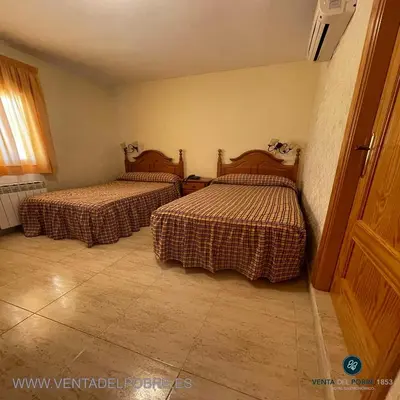 Cama o camas de una habitación en Hotel Venta del Pobre
