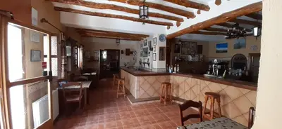 Una cocina o zona de cocina en Pensión La Fuente
