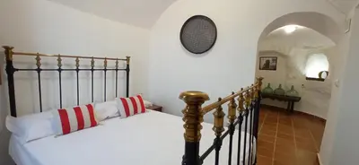 Cama o camas de una habitación en Cueva de Manuela