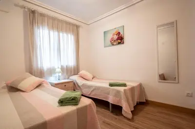 Cama o camas de una habitación en Lovely apartment near the beach