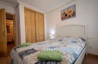 Cama o camas de una habitación en Lovely apartment near the beach