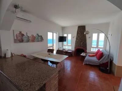 Una televisión o centro de entretenimiento en Casa Mar