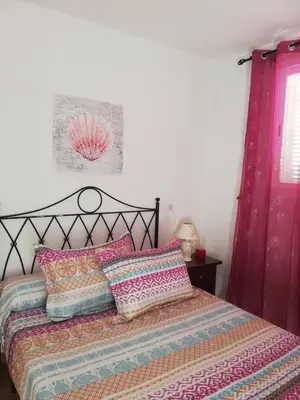 Cama o camas de una habitación en Apartamento Naturista en primera línea en Natura World!