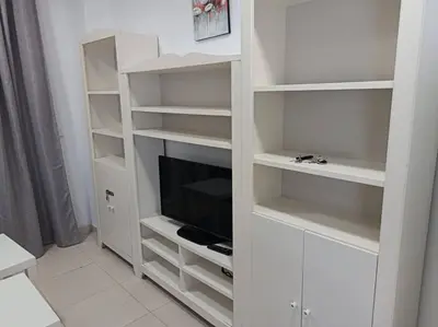Una televisión o centro de entretenimiento en Vera Playa Apto 1-4 Personas Piscina Parking WI-FI