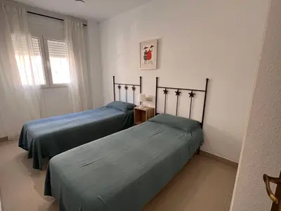 Cama o camas de una habitación en Apartamento DELAMAR BAJEL46