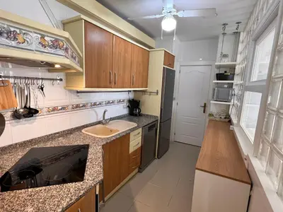 Una cocina o zona de cocina en Apartamento DELAMAR BAJEL46
