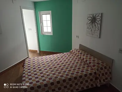 Cama o camas de una habitación en casa rural Sombra de la Atalaya