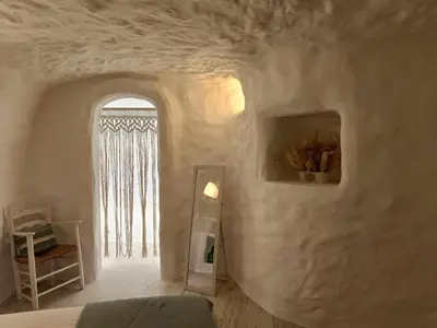Cama o camas de una habitación en Cueva OTTO Familiar Privada