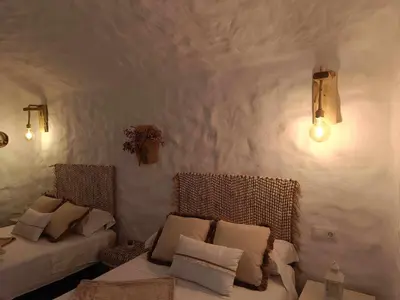 Cama o camas de una habitación en Cueva OTTO Familiar Privada