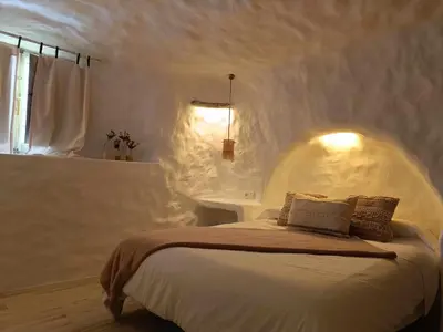 Cama o camas de una habitación en Cueva OTTO Familiar Privada