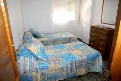 Cama o camas de una habitación en AMPLIO APTO en ROQUETAS