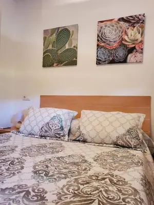 Cama o camas de una habitación en BAJO con JARDÍN PROPIO EN VALLE DEL ESTE GOLF!!
